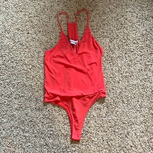 Kittenish body suit. New with tags!